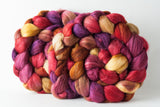 Merino/superwash merino/silk (MMS) spinning fiber: Red, gold, orange. caramel, purple